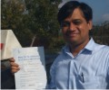 Sameer with Driving test pass certificate